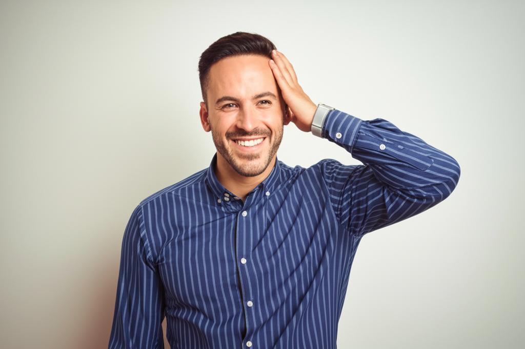 A man looking stressed and holding his head, transitioning to a man smiling confidently